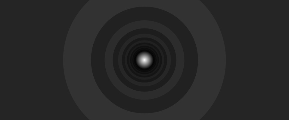 Grey rings drifting towards a light